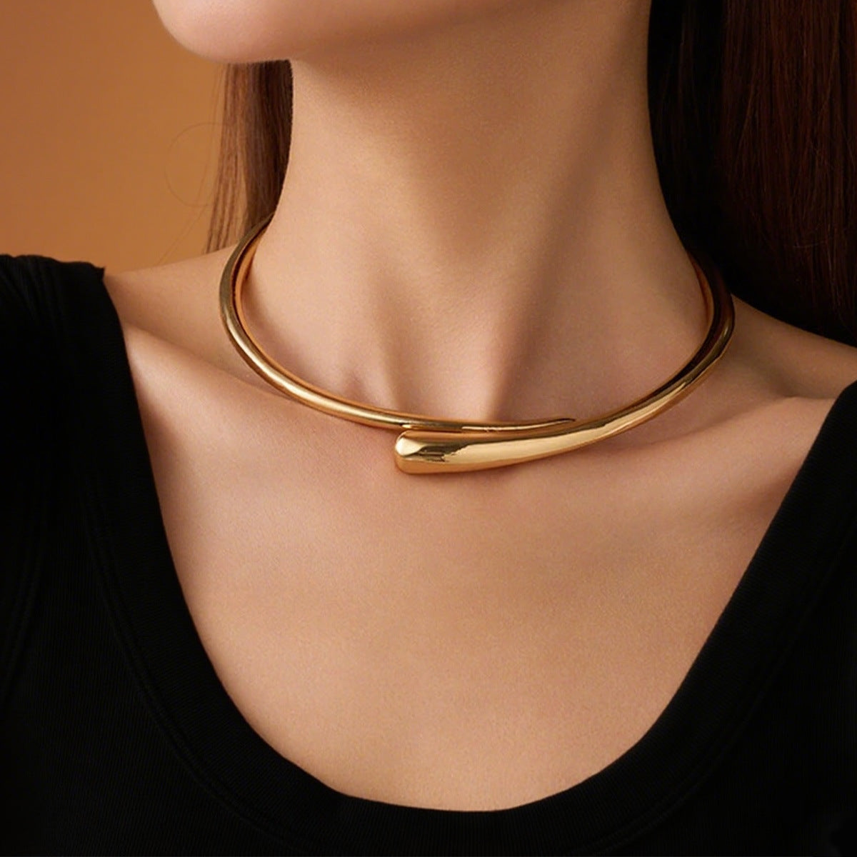 AVESSAE Sculptural Teardrop Collar Necklace in gold on model