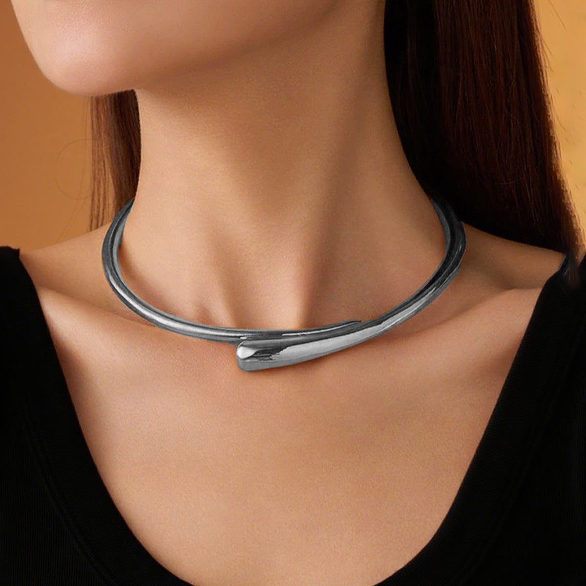 AVESSAE Sculptural Teardrop Collar Necklace in silver on model